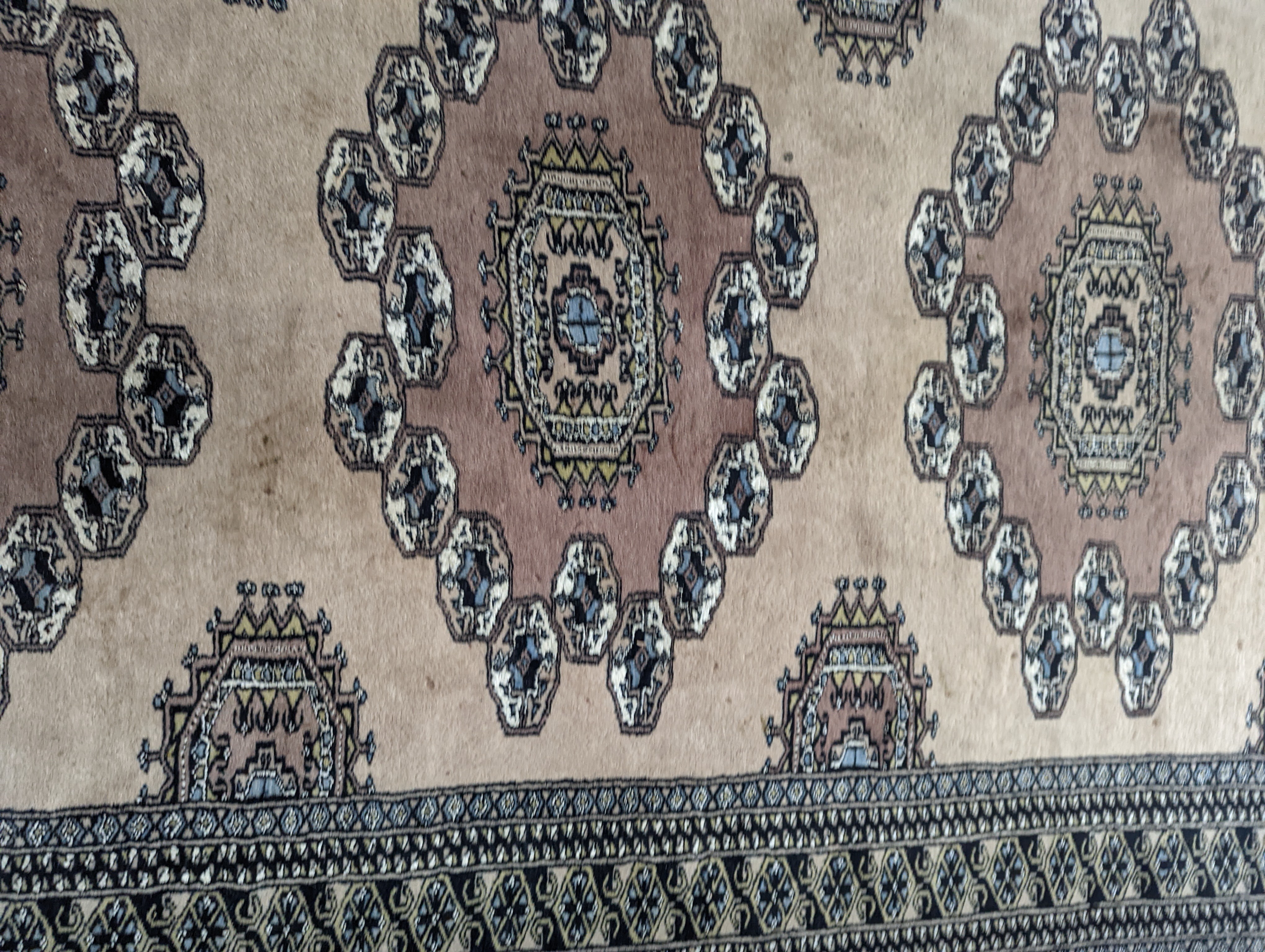 A Pakistan Bokhara style pink ground rug, 210 x 127cm